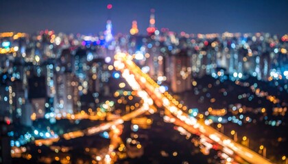 Blurred São Paulo skyline with highway lights and bright night colors.