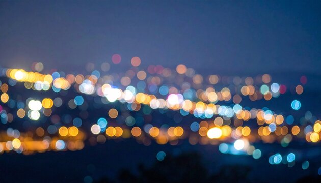 Blurred night city lights with blue and yellow bokeh motion.