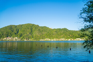 Spring view of Lake Lugano in the town of Caslano in the Swiss mountains