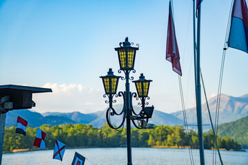 View of boats moored on Lake Lugano, village of Caslano. Switzerland