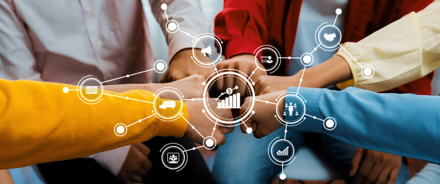 A vibrant image showcasing diverse team collaboration with fists bumping, surrounded by digital marketing icons symbolizing business growth and partnership success. Amity - Powered by Adobe