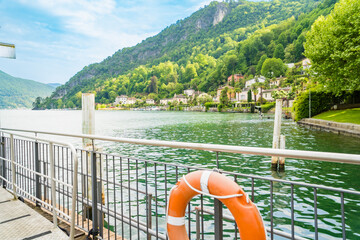 Spring view of Lake Lugano in the town of Caslano in the Swiss mountains