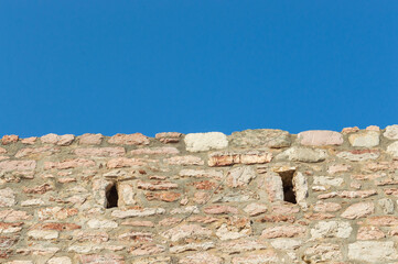 A fragment of the stone medieval fortress of Sveti Stefan island-hotel, on the Adriatic coast, Montenegro. Details