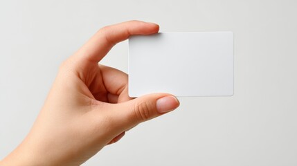 Woman holding empty white card on white background