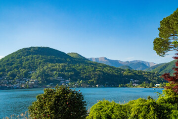 Spring view of Lake Lugano in the town of Caslano in the Swiss mountains