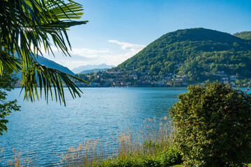 Spring view of Lake Lugano in the town of Caslano in the Swiss mountains