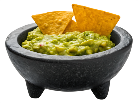 Delicious guacamole with tortilla chips isolated on a white background