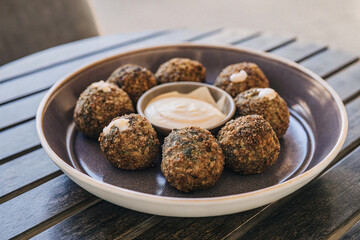 a plate of golden  crispy falafel balls