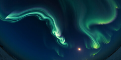 Aurora borealis with green light streaks against a dark blue sky with a bright star visible
