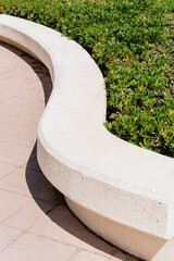 Curved Concrete Bench in Park