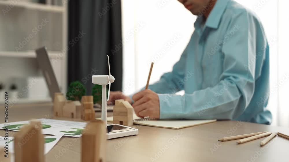 Poster windmill model represented using clean energy and wooden block symbolized ecology house. green power