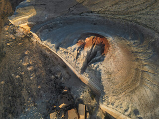 The camera glides around a steep cliff of Aktumsuk cape, where fractured sandstone blocks lie at...