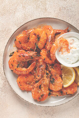 fried white-footed shrimp, tiger prawns vannamey, on a plate, with lemon and herbs, no people,