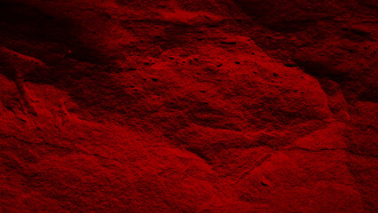 abstract saturated red wall or surface with a textured, grunge stone appearance, suitable for use as a dramatic background or artistic element.