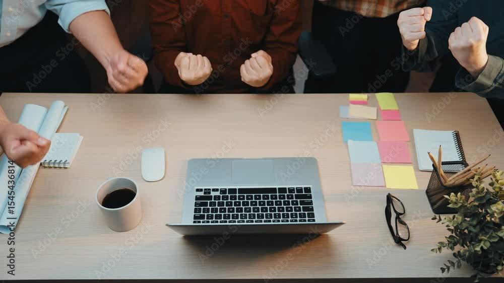 Aufkleber a dynamic team engages in a collaborative meeting in a modern office, focusing on a laptop while sur