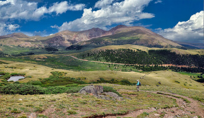 Hiker descending the Squaretop Lakes Trail off Colorado's Guanella Pass near Georgetown
