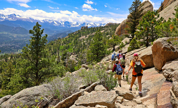 Hikers descending the Gem Lake Trail in Rocky Mountain National Park, Colorado - Powered by Adobe