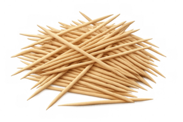 Wooden toothpicks scattered on clear surface, highlighting minimalist design for culinary or oral care purposes