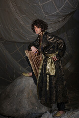 Sophisticated male party look merging contemporary suit with Arabian Nights fantasy