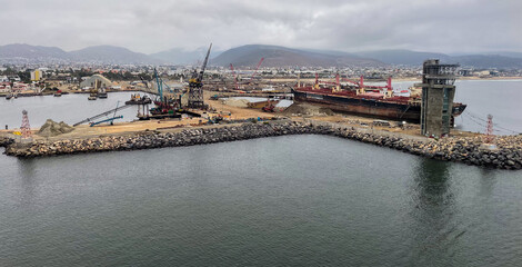 Ensenada, Mexico, June 5, 2025: The Entrance to Ensenada Harbor looking at the industrial Quay Dock where ships are repaired and anchored