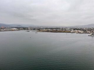 Ensenada, Mexico, June 5, 2025: The Entrance to Ensenada Harbor looking at the industrial Quay Dock where ships are repaired and anchored