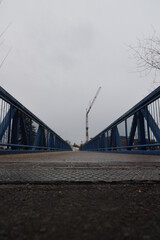 Fototapeta premium A bridge with a crane in the background