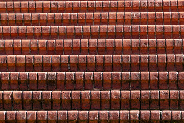 Detail of brick stairs with a rustic and sturdy appearance, showcasing the natural texture of the...