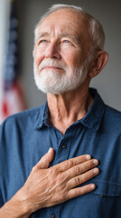 Proud elderly veteran with hand on heart in patriotic reflection