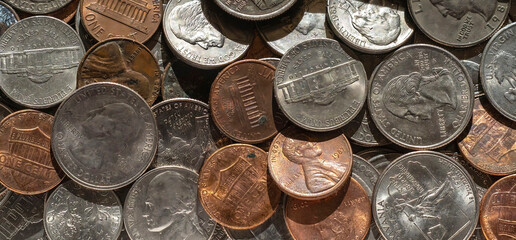 Close-up of dollar coins extended on a table. Background.