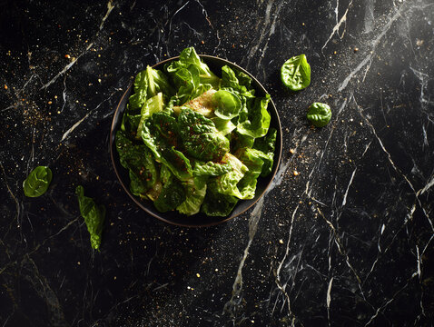 Fresh Appetising Greek Salad Overhead on Dark marble counter