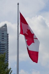 Canadian Flag Flying Against a Cloudy Sky