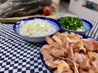 Raw Chicken, Chopped Onion, Green Peppers and Garlic