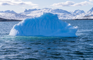 Iceberg seen on tour on fjord near the capital city of Nuuk near Sermitsiaq mountain