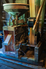 A belt drive grain mill