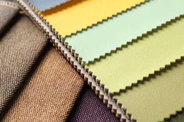 Samples of different fabrics as background, closeup