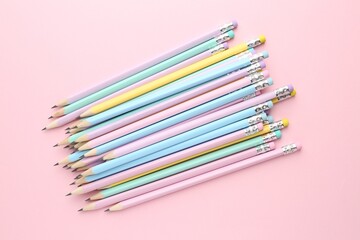 Many graphite pencils on pink background, flat lay