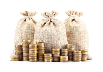 Bags and stacked coins isolated on white