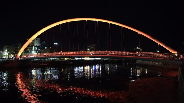 Gangmun Sotdae Bridge Lit in Red Over Gyeongpo Stream