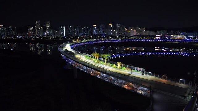 Panning Across Geumgang Pedestrian Bridge and Sejong Skyline at Night