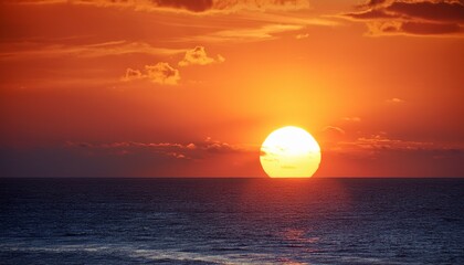 big sun sunset over the ocean