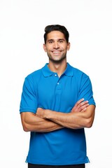 A man in a blue polo shirt with his arms crossed, looking confident and relaxed.