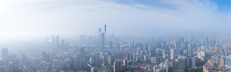 aerial view of Shanghai skyline with heavy fog.