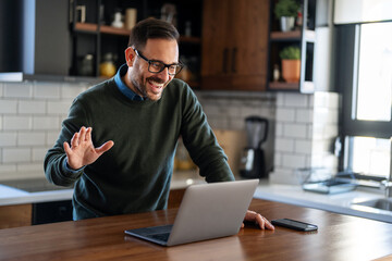 Businessman executive coach using laptop computer, having video conference call virtual meeting