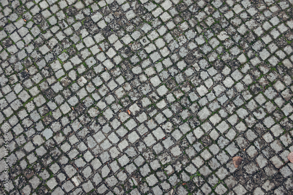 Poster a gray stone tile floor with a pattern of squares