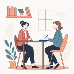 Two women sitting at a table having a meeting discussion