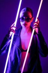A stylish woman poses with neon light tubes, creating a cool and vibrant image