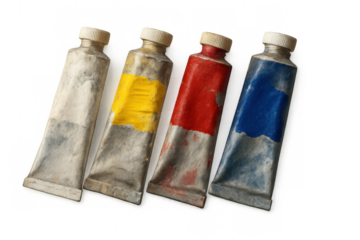 Paint tubes squeezed, spilling vibrant white, yellow, red, blue colors, lying on transparent surface, ready for artistic expression