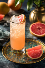 A Grapefruit Paloma CocktailWith Lots of Ice In A Tall Glass