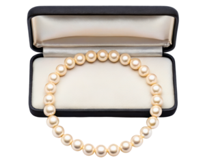 Pearl necklace displayed in an open black jewelry box on a transparent background