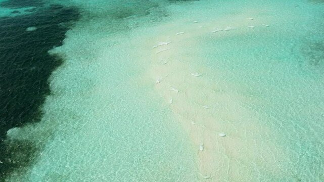 Turquoise lagoon surface on atoll and coral reef, copy space for text. Balabac, Palawan. Philippines.
